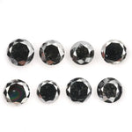 Lot of natural salt and pepper round cut diamonds with dark grey and black inclusions, genuine rustic galaxy diamonds for custom jewelry making, loose natural diamonds arranged on white background.