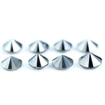 Lot of natural salt and pepper round cut diamonds with dark grey and black inclusions, genuine rustic galaxy diamonds for custom jewelry making, loose natural diamonds arranged on white background.