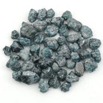 natural blue rough diamond with a raw uncut surface for jewelry designers