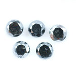 Five natural round cut black diamonds with faceted surfaces showing natural inclusions and dark carbon tones, loose untreated genuine diamonds suitable for custom jewelry making.