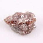 a raw diamond showing cost of raw diamond and how to identify a raw diamond at home with loose raw diamonds and a natural raw diamond ring display