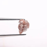 a raw diamond showing cost of raw diamond and how to identify a raw diamond at home with loose raw diamonds and a natural raw diamond ring display
