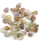mixed color natural rough diamond pieces with uncut raw surfaces for custom jewelry
