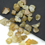 natural fancy yellow rough diamond with raw uncut surface and loose irregular stone
