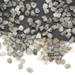 grey raw diamond with an uncut rough surface for jewelry making and custom designs