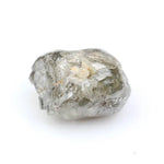 Collection of raw gems and loose rough diamonds.