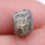 Collection of raw gems and loose rough diamonds.