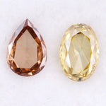 Two lab grown diamonds displayed on white background, including a fancy light yellow oval cut diamond labeled 1 and a champagne pear shaped diamond labeled 2, sustainably created loose stones for engagement rings.