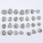 Grey diamond gemstone with natural smoky color and brilliant polish