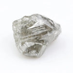 Large raw gemstones and rough diamond crystals displayed together.