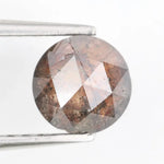 0.78 carat brownish black natural diamond round cut loose stone with subtle dual tone color blend