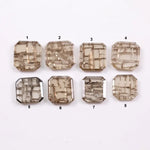 Square cut lab grown diamond with champagne tone and distinctive geometric grid-like inclusions, octagonal step cut, transparent stone for modern sustainable fine jewelry design.