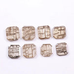 Square cut lab grown diamond with champagne tone and distinctive geometric grid-like inclusions, octagonal step cut, transparent stone for modern sustainable fine jewelry design.