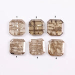 Six octagon step cut lab grown diamonds in champagne tones with visible natural-style inclusions, arranged on a white background for fine jewelry design.