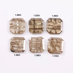 Six octagon step cut lab grown diamonds in champagne tones with visible natural-style inclusions, arranged on a white background for fine jewelry design.