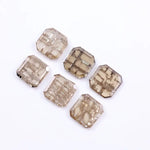 Six octagon step cut lab grown diamonds in champagne tones with visible natural-style inclusions, arranged on a white background for fine jewelry design.