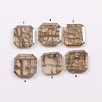 Six emerald cut octagonal lab grown diamonds featuring distinctive golden vein-like inclusions in a transparent champagne-toned base, displayed on a white background.