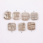 Emerald cut lab grown diamond with visible natural-style inclusions and salt and pepper pattern, octagon step cut sustainable gemstone for engagement ring or custom fine jewelry.