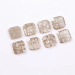 Eight square step cut lab grown diamonds in champagne tone arranged in two rows, featuring visible natural-style inclusions and emerald-style faceting on a white background.
