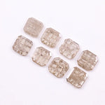 Eight square step cut lab grown diamonds in champagne tone arranged in two rows, featuring visible natural-style inclusions and emerald-style faceting on a white background.