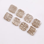 Eight square step cut lab grown diamonds in champagne tone arranged in two rows, featuring visible natural-style inclusions and emerald-style faceting on a white background.