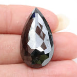 pear cut , grey black natural loose diamond , what does diamond represent in engagement ring symbolism and love