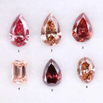 Six lab grown fancy colored diamonds in pink, blush, champagne and deep rose tones featuring pear, oval and emerald cuts displayed on a white background for fine jewelry design.