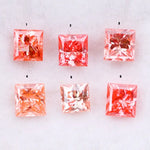 Six square princess cut pink lab grown diamonds in varying shades from light blush to vivid pink, displayed on a white background, featuring brilliant faceting and high clarity for luxury jewelry settings.