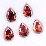 Five pear-shaped lab grown diamonds in fancy deep pinkish red color arranged on a white background, featuring brilliant faceting and teardrop cut for engagement rings and custom fine jewelry.