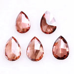 Five pear-shaped lab grown diamonds in fancy deep pinkish red color arranged on a white background, featuring brilliant faceting and teardrop cut for engagement rings and custom fine jewelry.