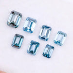 Close-up of emerald-cut lab-grown blue diamonds showcasing exceptional clarity and vibrant color, ideal for high-end jewelry designs.