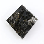 sharp kite cut rustic black diamond gemstone showcasing brilliant, highly reflective facets across a sleek triangular silhouette.