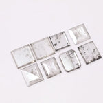 Square step-cut lab grown diamond with beveled edges and geometric faceting, loose ethical man made diamond for engagement ring or custom fine jewelry setting displayed on white background.