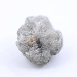 Natural grey diamond loose stone with raw texture and smoky charcoal tone for custom engagement ring design.