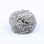Salt and pepper diamond rough crystal with natural inclusions and rustic grey appearance.