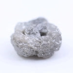 Salt and pepper diamond rough crystal with natural inclusions and rustic grey appearance.