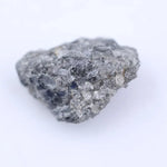Close-up of rough diamond stone highlighting its natural shape and pristine unpolished surface for jewelry.