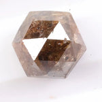 Earth-mined natural brown diamond stone photographed in high resolution, showing real color saturation and natural structure.