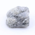 Raw diamond with rugged edges and natural brilliance, perfect for unique handcrafted jewelry designs.