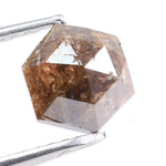 Earth-mined natural brown diamond stone photographed in high resolution, showing real color saturation and natural structure.