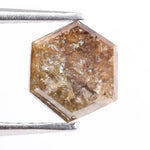 Earth-mined natural brown diamond stone photographed in high resolution, showing real color saturation and natural structure.