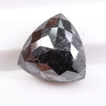 Natural black diamond stone showcasing rare fancy black color, earth-mined origin, and natural crystal formation.