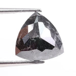 Natural black diamond stone showcasing rare fancy black color, earth-mined origin, and natural crystal formation.
