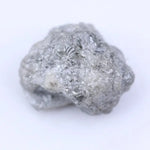 Loose uncut diamond stone in natural rough form showing original crystal surface and natural brilliance