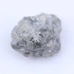 Loose uncut diamond stone in natural rough form showing original crystal surface and natural brilliance
