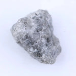 Uncut diamond crystal showing natural octahedral structure and raw gemstone brilliance