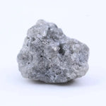 Uncut diamond crystal showing natural octahedral structure and raw gemstone brilliance