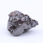 Uncut red tone rough diamond crystal with natural color variation and raw gemstone texture