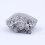 Loose natural raw diamond stone with uneven crystal structure and organic surface texture