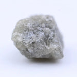 Raw diamond crystal close-up showing natural inclusions and original uncut gemstone structure